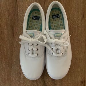 Keds white stretch sneakers.